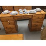 20th cent. Pine twin pedestal desk with eight drawers.