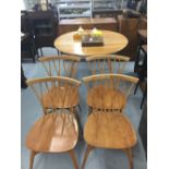 20th cent. Honey oak Ercol dining room suite, table, chairs x 4, and sideboard.