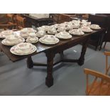 20th Oak draw leaf table with turned barrel supports, manufactured by Titchmarsh and Godwin,