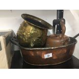Copper and Brassware: A large copper and iron pan, early electric kettle, and a brass planter.