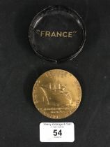 OCEAN LINER: France maiden voyage medallion on the box of issue. 2¼ins.