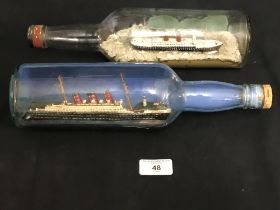 CUNARD: Naive scratch built ships in bottles showing Cunarders at sea - a pair. 12ins.