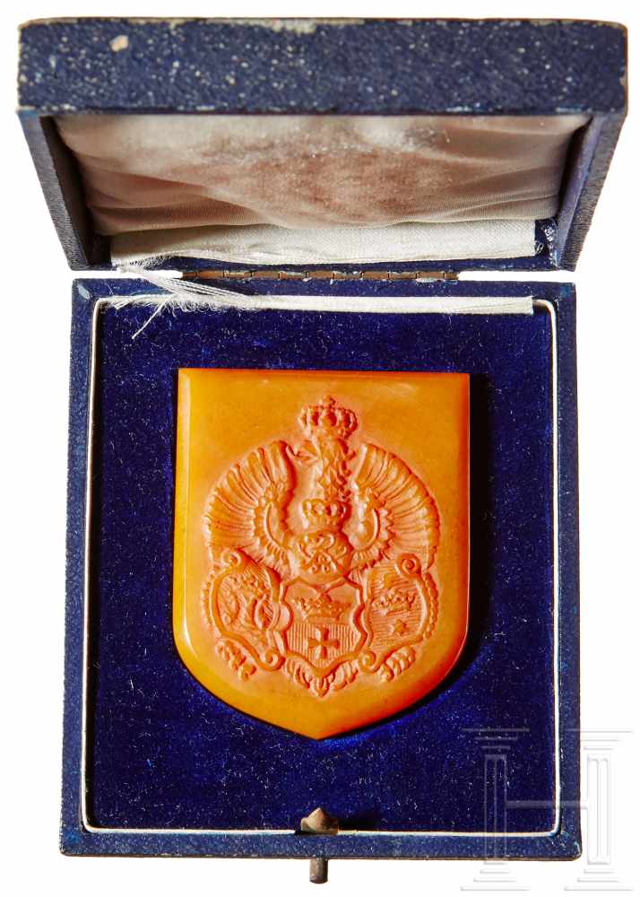 An Amber Königsberg Coat of ArmsNon-portable award in matte finished amber with raised coat of arms,