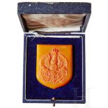 An Amber Königsberg Coat of ArmsNon-portable award in matte finished amber with raised coat of arms,