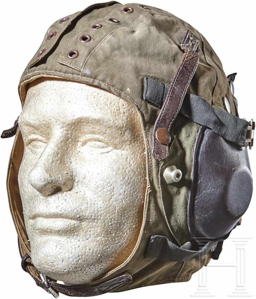 An East German Flight HelmetFive panel, olive canvas cloth construction with grommets on two