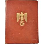 A Promotion Document FolderRed Morocco leather with gold-embossed national eagle on front, the