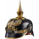 A Model 1915 Prussian Officer Infantry HelmetBlack leather body with gilt front visor trim; worn