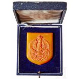 An Amber Königsberg Coat of ArmsNon-portable award in matte finished amber with raised coat of arms,