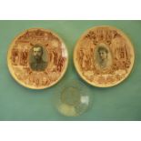 A pair of pottery plates printed in brown and centred by oval monochrome portraits of Nicolas II and