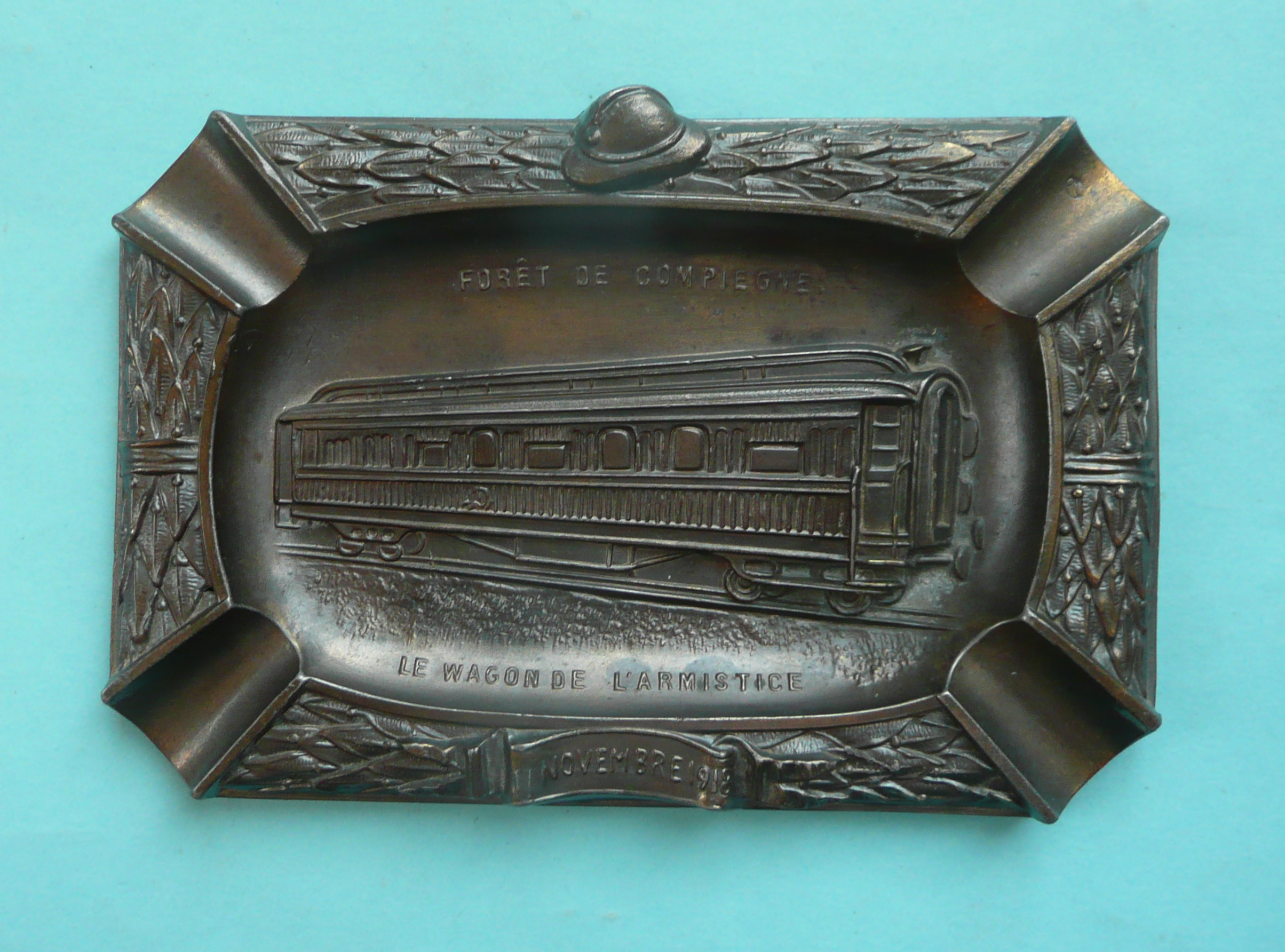 1918 Armistice: a French spelter ashtray cast with an inscribed and dated view of the railway