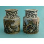 Uncle Tom and Eva (91) a matched pair of black mottled jars, minor hairline crack and restoration to