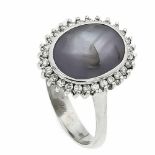 Sternsaphir-Brillant-Ring WG 750/000 mit einem ovalen, blassvioletten Sternsaphir sowieBrillanten,