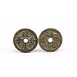 2 Münzamulette, China, dunkle Bronze, beidseitige Reliefs, Ø jeweils 4,5 cm2 coin amulets, China,