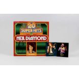 Neil Diamond, 2 Fotos und LP, 20 Super Hits, 1975, jeweils mit OriginalautogrammenNeil Diamond, 2