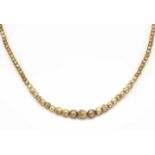 Perlenkette mit Karabiner GG 333/000 mit goldfarbenen Perlen 6 - 3 mm, teilweiseAbplatzer, L. 39 cm,