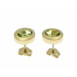 Peridot-Ohrstecker GG 750/000 mit 2 oval fac. Peridots 6,8 x 5 mm in guter Farbe, L. 9,7mm, 3,2