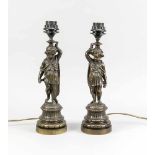 Paar figürliche Lampen, Bronze, Anfang 20. Jh. Profilierte und kannelierte Postamente.Darauf, auf
