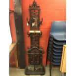 A CAST IRON FULL HEIGHT HALL STAND, FOUR
