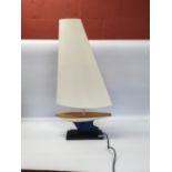 A DAVID HUNT DESIGNER LAMP IN THE FORM O
