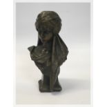 A BRONZE BUST OF WOMAN BEARING NAME SCHE