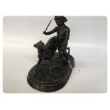 BRONZE STUDY OF A BOY TRAINING HIS DOG,