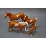 Three Beswick Palomino gloss horses and a foal