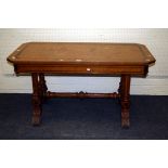 A Victorian quilted oak and ebony strung library table, the Greek key banded canted rectangular top