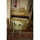 A Victorian decoratively painted harmonium and matching chair, 108cm wide