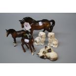 Three Beswick brown gloss horses, a pair of Beswick seated spaniels and a Siamese kitten group