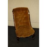A Victorian mahogany framed gold button plush upholstered parlour nursing chair, with cabriole