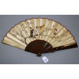 An early 20th century probably Venetian fan, the silk painted with a child harlequin suspending