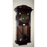 A circa 1930s mahogany cased wall clock, the eight-day German gong striking movement faced by a