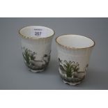 A pair of late Meissen 'Swan Service' beakers, each of wrythen form, blue crossed swords marks, 9cm