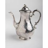 A Victorian coffee pot, baluster form, profusely decorated with scrolling foliage, the domed