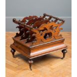 A Victorian rosewood three division scroll carved Canterbury, fitted single drawer on turned
