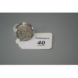 A large 14ct gold pavé diamond ring, circular, with scalloped frame and wide tapering shoulders,