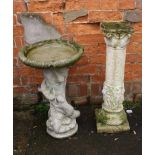 A composite garden bird bath with squirrel moulded decoration, together with another column with