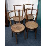 A set of four 19th century Thonet bentwood dining chairs, each with embossed circular seat