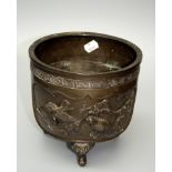 A Meiji Period bronze censer decorated in relief with reserves of finches and flowering trees