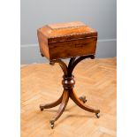An early 19th century rosewood teapoy, the egg and dart moulded caddy top on a swept shouldered
