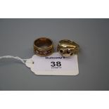 A 9ct gold double headed serpent ring and a 9ct gold and diamond five stone ring