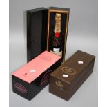 A presentation cased bottle of Moet Chandon Brut Imperial champagne, a cased bottle of Laurent-