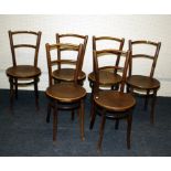 A set of six 19th century Thonet bentwood dining chairs, each with florally embossed circular seat