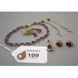 A gold and amethyst line bracelet, a gold and single stone amethyst pear-shaped pendant, a pair of