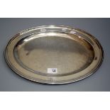 Heath and Middleton, a late 19th century oval silver meat dish, with engraved monogram to rim,