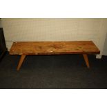 A rustic yew bench/window seat with single piece top on square splayed beech legs, 38 x 157 x 46cm