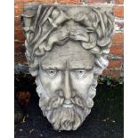 A composition architectural keystone modelled as a River God mask, 63 x 40cm