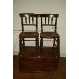 A 19th elm coffer, 43 x 90 x 55cm and a pair of rush seated dining chairs