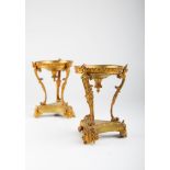 A pair of 19th century ormolu cassolette stands, each with dished top on caryatid supports,