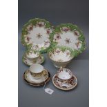 A 19th century English porcelain part tea service, comprising a pair of cake plates, slop, four cups